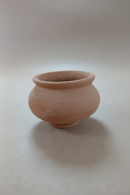A waterer and feeder made of pottery, made for birds