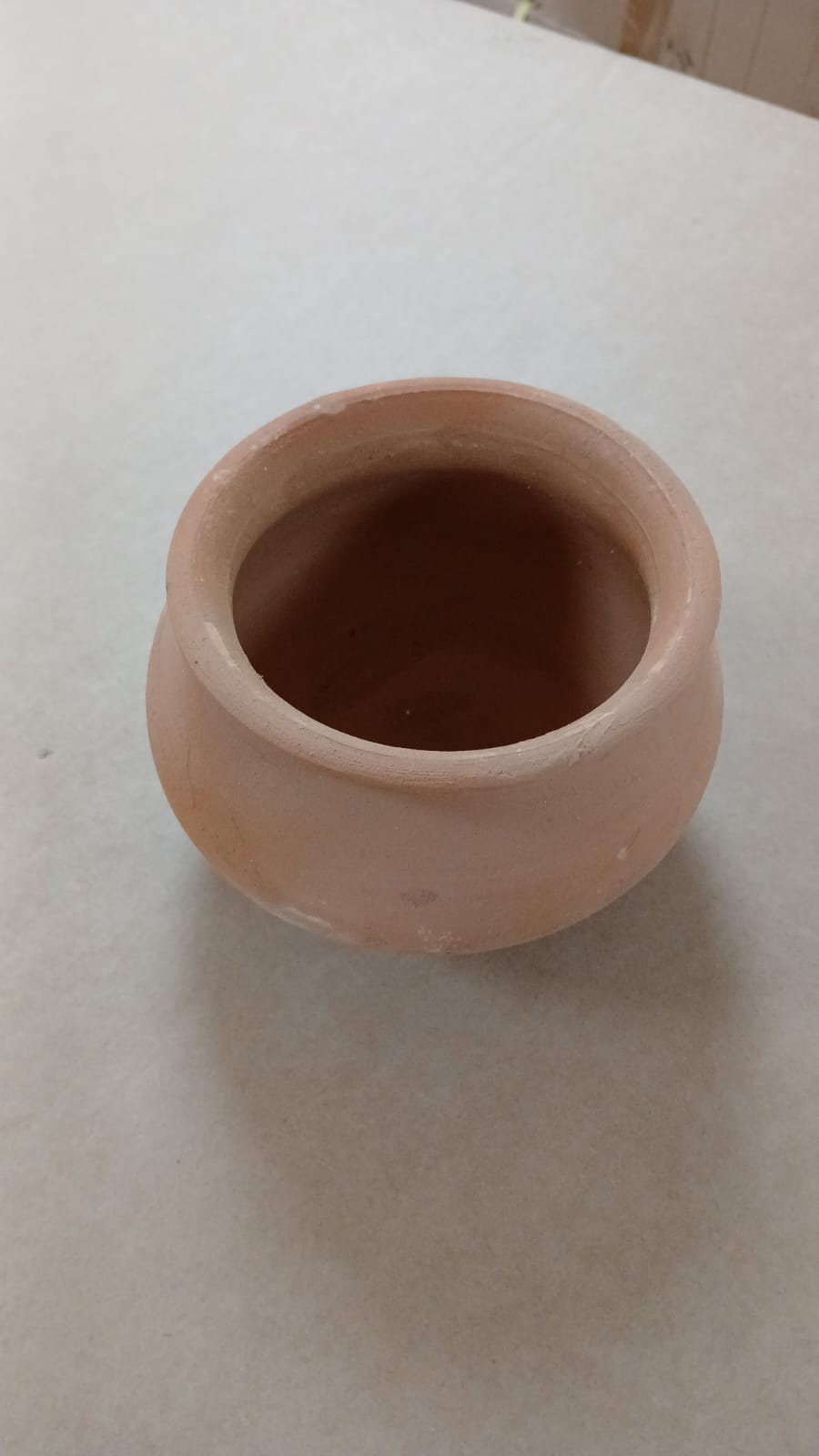 A waterer and feeder made of pottery, made for birds